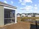 Screened porch overlooking a pond and neighborhood at 1143 Sennema Circle, Myrtle Beach, SC 29588