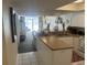 Kitchen with breakfast bar, view into living room at 158 Seawatch Dr. # 712, Myrtle Beach, SC 29572