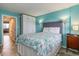 Bedroom with a bed, white built-ins, and ocean-themed bedding at 2001 S Ocean Blvd. # 1102, Myrtle Beach, SC 29577