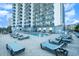 Expansive pool deck with numerous lounge chairs for relaxation at 2001 S Ocean Blvd. # 1102, Myrtle Beach, SC 29577
