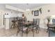 Dining area with tile floor and metal table and chairs at 2001 S Ocean Blvd. # 801, North Myrtle Beach, SC 29582