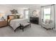 Spacious main bedroom with a king-size bed and en suite bathroom at 2108 Copper Creek Ct., Longs, SC 29568