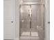 Large walk-in shower with gray tile and a built-in bench at 2108 Copper Creek Ct., Longs, SC 29568