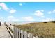 Wooden walkway to the beach with dune views at 2200 N Ocean Blvd. # 503, North Myrtle Beach, SC 29582