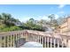 Private balcony with table and chairs, offering a view of the surrounding neighborhood at 305 S 21St Ave. S # 112, Myrtle Beach, SC 29577