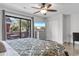 King-size bedroom with sliding glass doors to a balcony and a large TV at 305 S 21St Ave. S # 112, Myrtle Beach, SC 29577