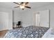 Bedroom with a queen-size bed, a desk, and double doors to a hallway at 305 S 21St Ave. S # 112, Myrtle Beach, SC 29577