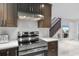 Modern kitchen with stainless steel appliances and dark wood cabinets at 305 S 21St Ave. S # 112, Myrtle Beach, SC 29577