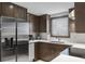 Modern kitchen with stainless steel appliances and dark wood cabinets at 305 S 21St Ave. S # 112, Myrtle Beach, SC 29577