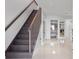 Modern staircase with dark wood and stainless steel railing at 305 S 21St Ave. S # 112, Myrtle Beach, SC 29577