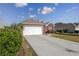 Brick home with a two-car garage and driveway at 3132 Robins Nest Way, Myrtle Beach, SC 29579