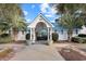 Community pool entrance with white building and gate at 3592 Evergreen Way # 3592, Myrtle Beach, SC 29577