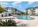 Relaxing community pool with lounge chairs and cabana at 4843 Carnation Circle # 105, Myrtle Beach, SC 29577