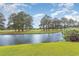 Serene view of a pond and lush golf course landscape at 4843 Carnation Circle # 105, Myrtle Beach, SC 29577