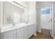 Double vanity bathroom with white cabinets and a shower at 5027 Billy K Trail, Myrtle Beach, SC 29579