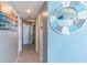 A condo hallway with tiled floors, beach decor, and light gray walls at 5523 N Ocean Blvd. # 1812, Myrtle Beach, SC 29577