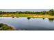 Golf course with a pond reflecting the surrounding landscape at 5801 Oyster Catcher Dr. # 1022, North Myrtle Beach, SC 29582