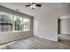 Bright bedroom with wood-look floors and large window at 5801 Oyster Catcher Dr. # 1022, North Myrtle Beach, SC 29582