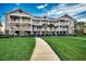 Attractive 3-story building with landscaped grounds at 5801 Oyster Catcher Dr. # 1022, North Myrtle Beach, SC 29582