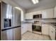 Modern kitchen with stainless steel appliances at 5801 Oyster Catcher Dr. # 1022, North Myrtle Beach, SC 29582
