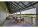 Outdoor patio with wicker furniture offering scenic golf course views at 5801 Oyster Catcher Dr. # 1022, North Myrtle Beach, SC 29582