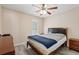 Bright bedroom with a comfortable bed, ceiling fan, and ample closet space at 659 Woodmoor Dr. # 302, Murrells Inlet, SC 29576