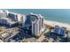 Aerial view of high-rise building near beach, showing surrounding buildings and ocean at 7100 N Ocean Blvd. # 424, Myrtle Beach, SC 29572