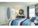 A nautical-themed bedroom with a striped comforter and ocean decor at 731 Isle Verde Dr, Myrtle Beach, SC 29579