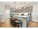 Modern kitchen with gray cabinets, quartz counters, and island at 76 Eagle Pass Dr., Murrells Inlet, SC 29576