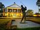 Night view of clubhouse with golfer statue in front at 870 Foxtail Dr. # C-35, Longs, SC 29568