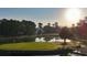 Aerial view of a golf course hole with a water hazard at 886 Foxtail Dr. # C-39, Longs, SC 29568