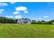 Gray house exterior with covered porch and large backyard at 926 Sandridge Rd., Little River, SC 29566