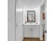 Bathroom with single vanity, white cabinets and view of the kitchen at 101 Westhill Circle # 5-C, Myrtle Beach, SC 29572