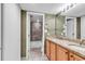 Bathroom with double vanity, granite countertop and large mirror at 101 Westhill Circle # 5-C, Myrtle Beach, SC 29572
