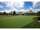Community clubhouse with putting green and expansive lawn at 101 Westhill Circle # 5-C, Myrtle Beach, SC 29572
