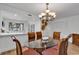 Dining room with a round glass table and six chairs at 101 Westhill Circle # 5-C, Myrtle Beach, SC 29572