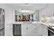 White kitchen with stainless steel appliances and view of dining area at 101 Westhill Circle # 5-C, Myrtle Beach, SC 29572