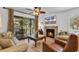 Living room with fireplace, TV, and access to a deck at 101 Westhill Circle # 5-C, Myrtle Beach, SC 29572