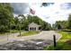 Gated community entrance with security booth and flag at 101 Westhill Circle # 5-C, Myrtle Beach, SC 29572