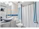 Bathroom with gray vanity and white shower curtain at 1605 S Ocean Blvd. # 1807, Myrtle Beach, SC 29577