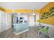 Kitchen with light green island and yellow walls at 1605 S Ocean Blvd. # 1807, Myrtle Beach, SC 29577