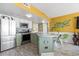 Kitchen with island and yellow walls at 1605 S Ocean Blvd. # 1807, Myrtle Beach, SC 29577