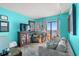 Living room with ocean view and teal walls at 1605 S Ocean Blvd. # 1807, Myrtle Beach, SC 29577