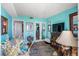 Living area with teal walls and ocean view at 1605 S Ocean Blvd. # 1807, Myrtle Beach, SC 29577