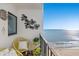 Balcony with ocean view, chairs, and decor at 1605 S Ocean Blvd. # 1807, Myrtle Beach, SC 29577