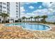 Outdoor pool with surrounding patio and lounge chairs at 1605 S Ocean Blvd. # 1807, Myrtle Beach, SC 29577