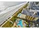 Aerial view of oceanfront pool and building at 1605 S Ocean Blvd. # 1807, Myrtle Beach, SC 29577