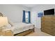 Bright bedroom with a queen bed, dresser, and large window at 2327 Lark Sparrow St., Myrtle Beach, SC 29577