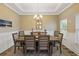 Formal dining room with a large table and chandelier at 2327 Lark Sparrow St., Myrtle Beach, SC 29577