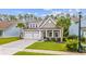 Two-story house with three-car garage and palm trees at 2327 Lark Sparrow St., Myrtle Beach, SC 29577